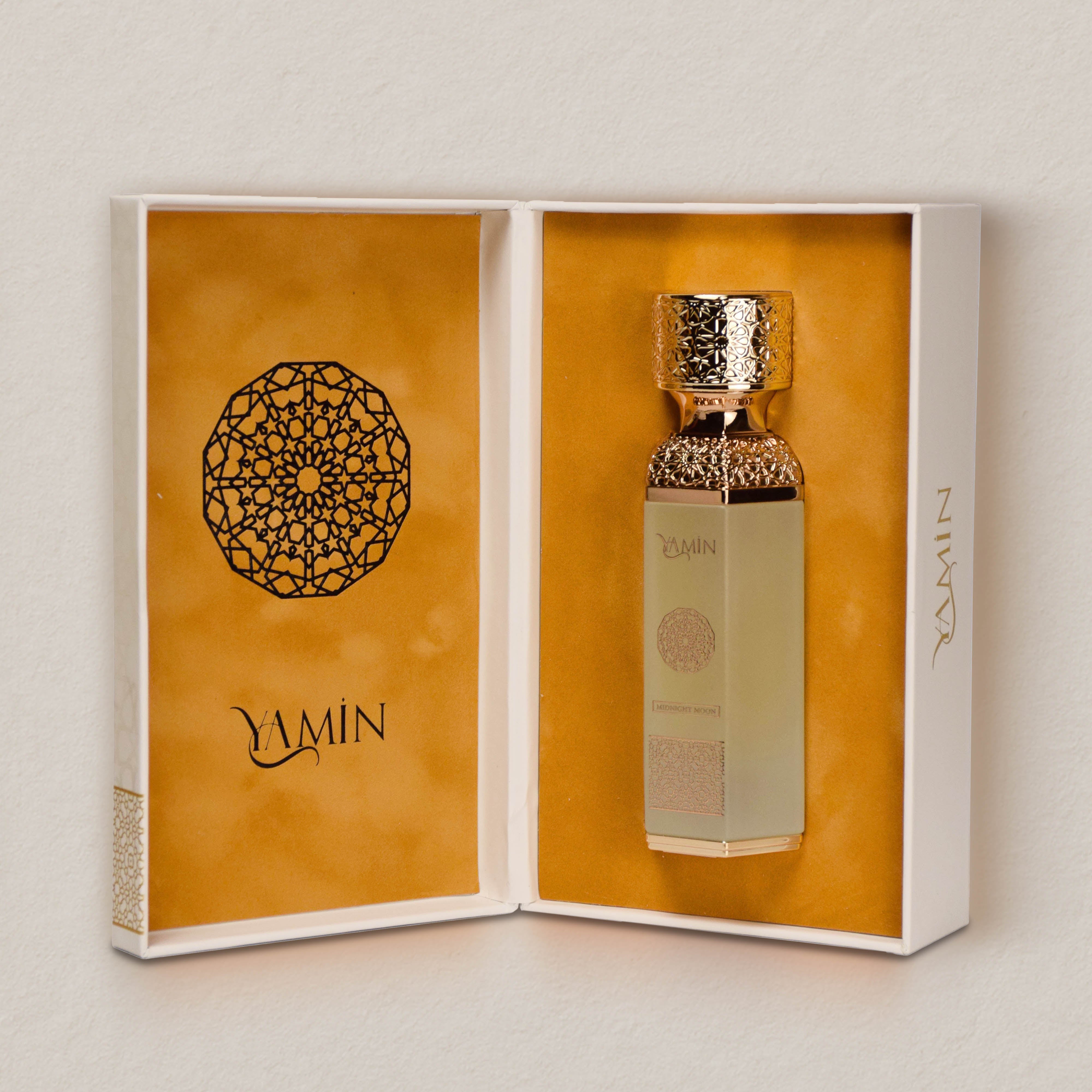 Midnight Moon perfume bottle with decorative cap in an open box featuring the brand 'Yamin'.