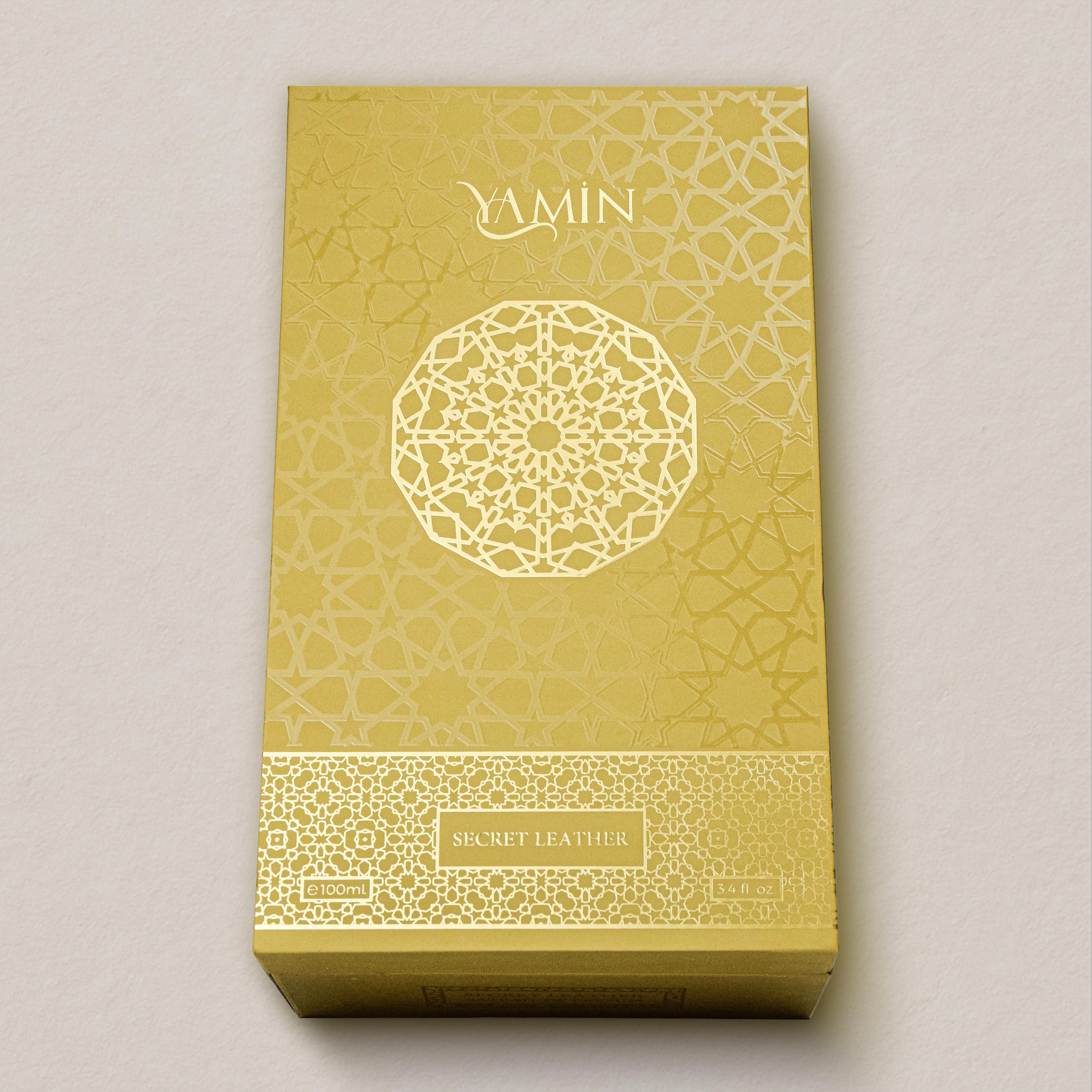 Gold packaging box with intricate patterns and 'Yamin' branding on a light gray background