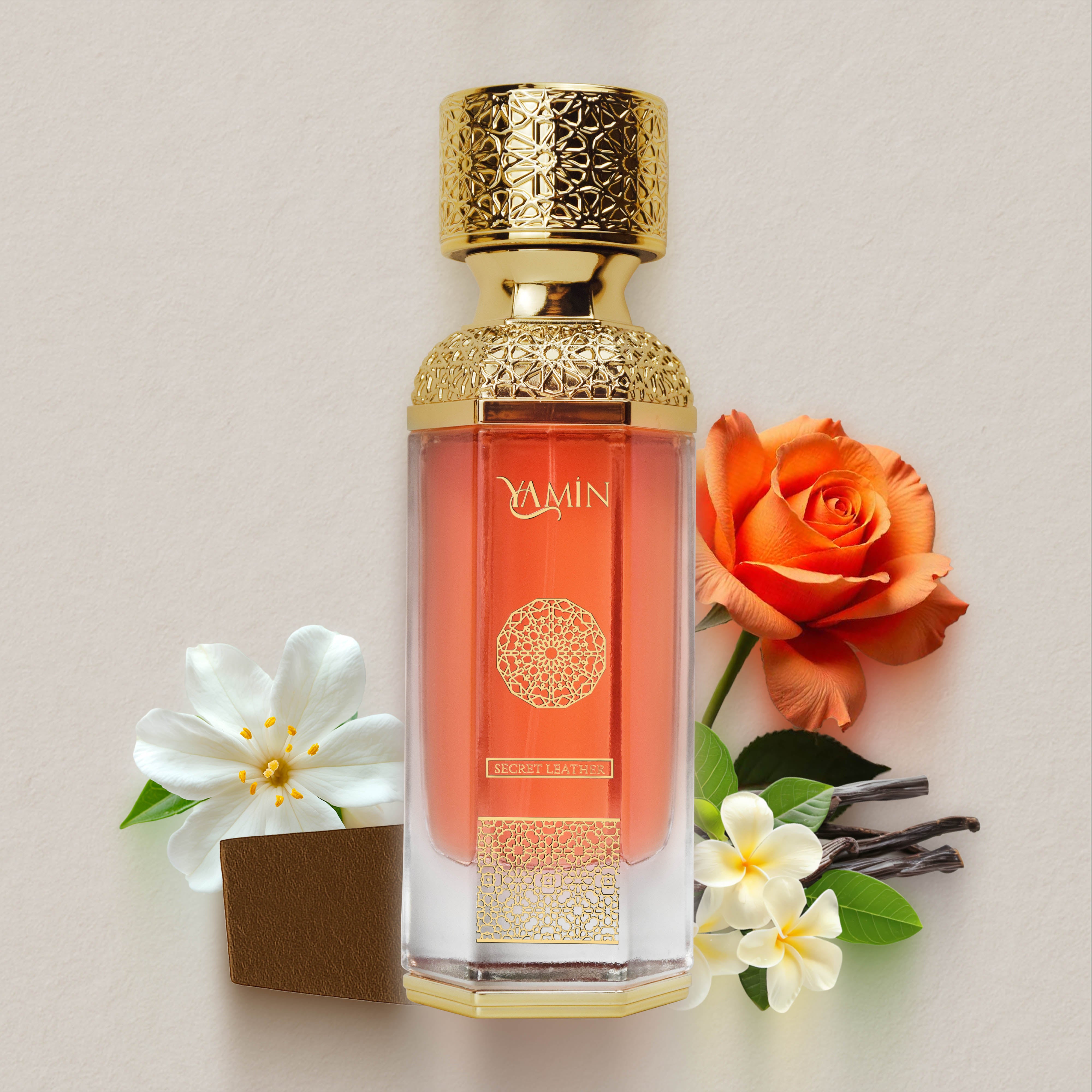 Secret Leather perfume bottle with gold cap and perfume notes on a light background